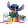 Stitch lendo com presentes